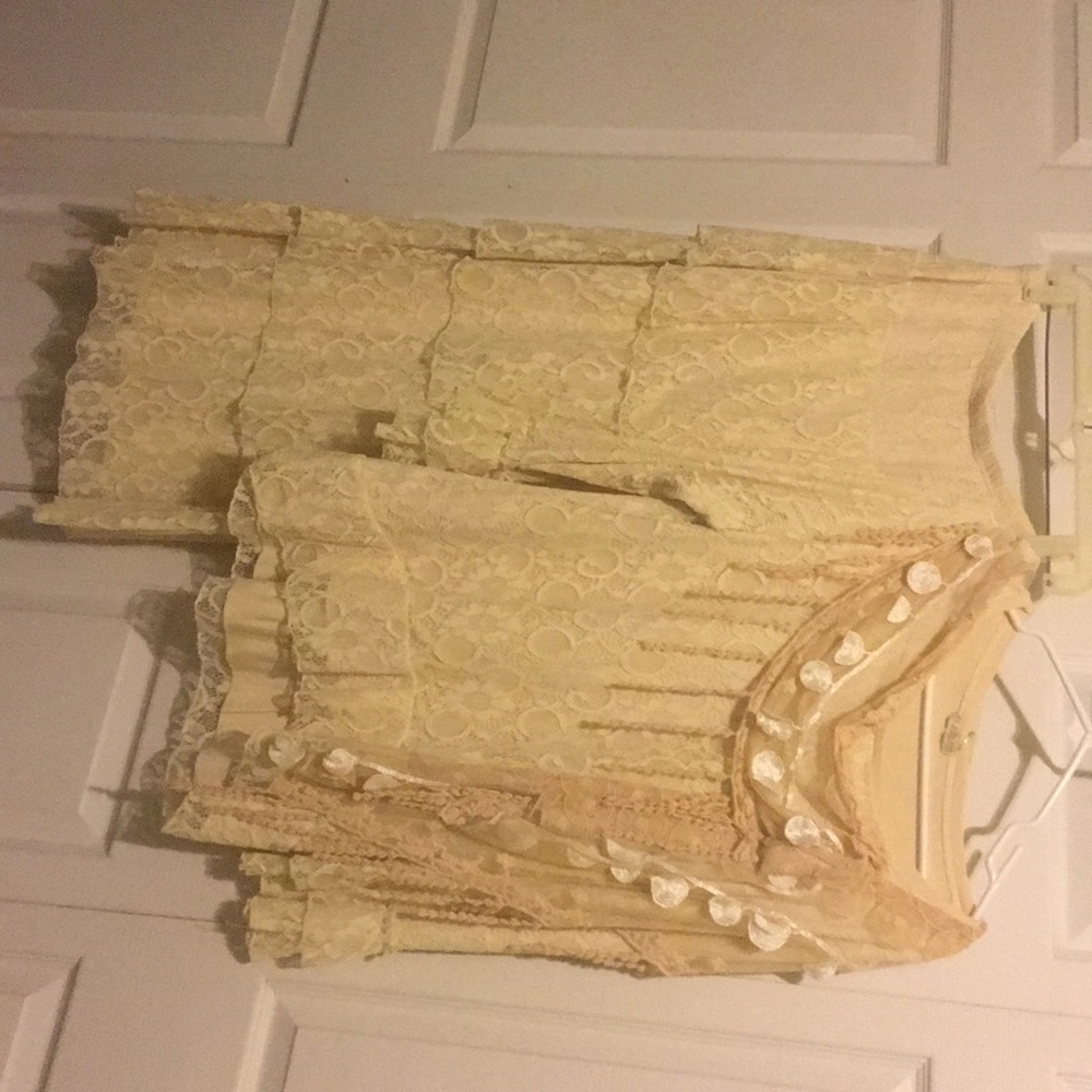 a cream lace outfit, it is a large